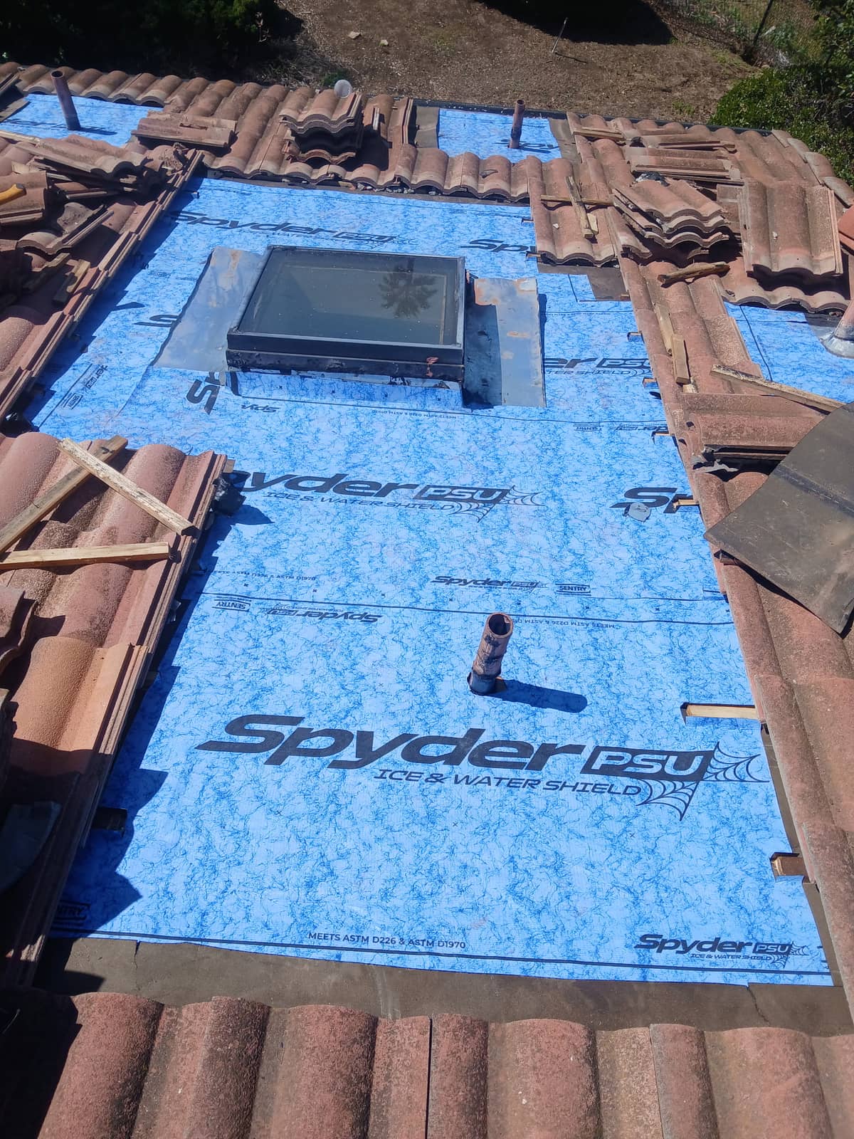 Skylight rebuilt with ice and water shield membrane during a tile roof repair