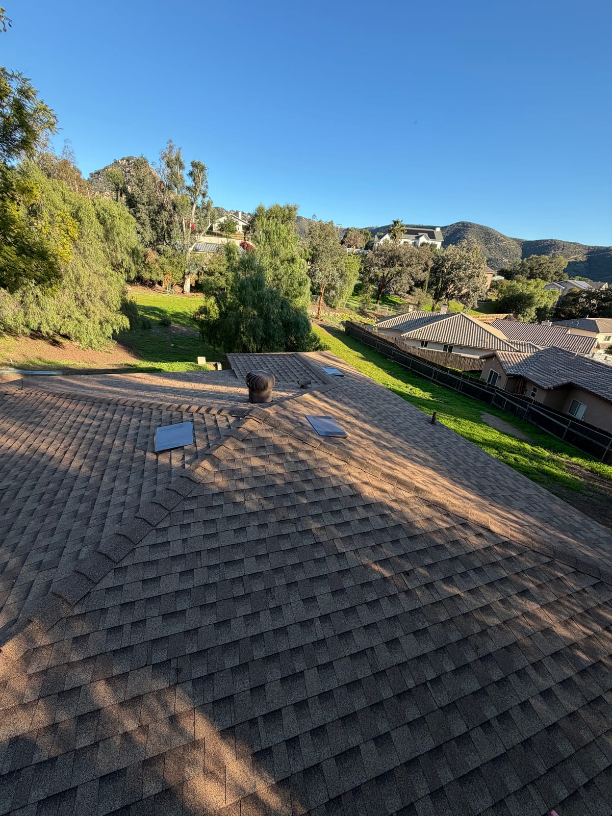 Fresh shingle field on a hillside home in morning light
