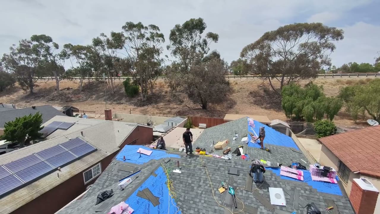 Crew mid re-roof with underlayment down and shingles going on